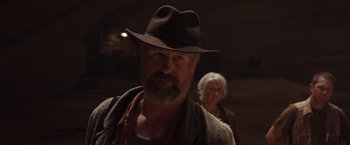 Movie still from “The Host” (2013), directed by Andrew Niccol – An older man wearing a hat and a scarf; Close Up shot, Low angle