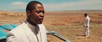 Movie still from “The Host” (2013), directed by Andrew Niccol – A man standing in the middle of an open field; Close Up shot, Over the shoulder angle