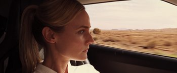 Movie still from “The Host” (2013), directed by Andrew Niccol – A woman sitting in the passenger seat of a car looking out the window; Close Up shot, Over the shoulder angle
