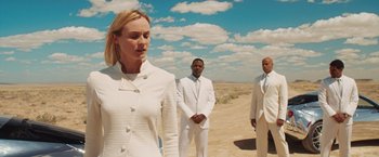 Movie still from “The Host” (2013), directed by Andrew Niccol – Three people dressed in all white standing in the desert; Medium shot, Over the shoulder angle