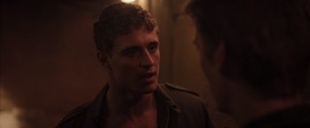 Movie still from “The Host” (2013), directed by Andrew Niccol – A man with a beard is standing in a room; Close Up shot, Over the shoulder angle