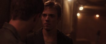 Movie still from “The Host” (2013), directed by Andrew Niccol – A young man with blonde hair stares into the camera; Close Up shot, Over the shoulder angle