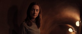 Movie still from “The Host” (2013), directed by Andrew Niccol – A woman with long brown hair is posing for a picture; Close Up shot, Low angle