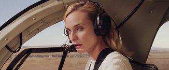 Movie still from “The Host” (2013), directed by Andrew Niccol – A woman wearing headphones in the cockpit of an airplane; Close Up shot, Low angle