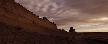 Movie still from “The Host” (2013), directed by Andrew Niccol – A view of a mountain range with a sky background; Extreme Wide shot, Low angle