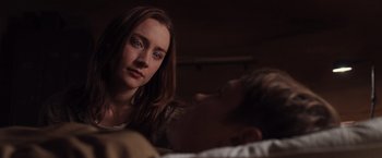 Movie still from “The Host” (2013), directed by Andrew Niccol – A woman sitting in front of a man laying on a bed; Close Up shot, Over the shoulder angle