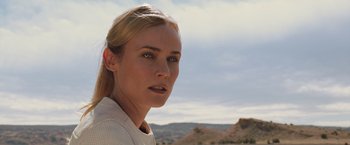 Movie still from “The Host” (2013), directed by Andrew Niccol – A beautiful blonde haired woman in front of a desert landscape; Close Up shot, Low angle