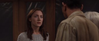 Movie still from “The Host” (2013), directed by Andrew Niccol – A woman looking at a man in front of a mirror; Close Up shot, Over the shoulder angle
