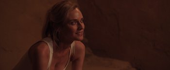Movie still from “The Host” (2013), directed by Andrew Niccol – A beautiful blonde woman smiling for the camera; Close Up shot, Over the shoulder angle