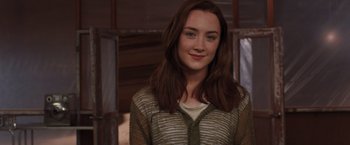 Movie still from “The Host” (2013), directed by Andrew Niccol – A woman with long brown hair wearing a brown shirt; Close Up shot, Over the shoulder angle