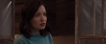 Movie still from “The Host” (2013), directed by Andrew Niccol – A young woman with blue eyes stares into the distance; Close Up shot, Over the shoulder angle