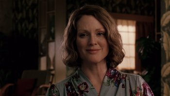 Movie still from “The Hours” (2002), directed by Stephen Daldry – A person wearing a floral shirt; Close Up shot, Over the shoulder angle