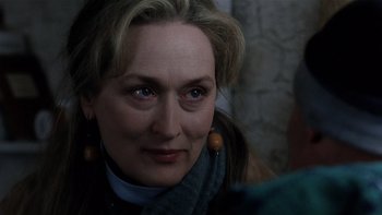 Movie still from “The Hours” (2002), directed by Stephen Daldry – A person wearing a scarf and earrings; Close Up shot, Over the shoulder angle