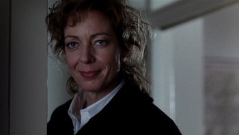 Movie still from “The Hours” (2002), directed by Stephen Daldry – A person smiling; Close Up shot, Over the shoulder angle