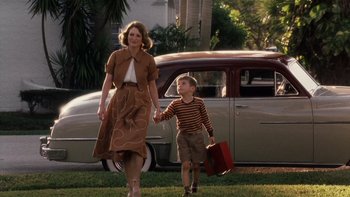 Movie still from “The Hours” (2002), directed by Stephen Daldry – A woman and a boy are walking in the grass; Wide shot, Low angle