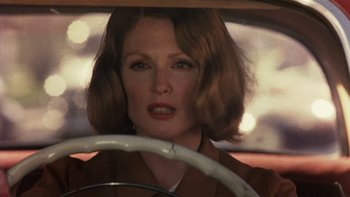 Movie still from “The Hours” (2002), directed by Stephen Daldry – A person driving a car; Close Up shot, Over the shoulder angle
