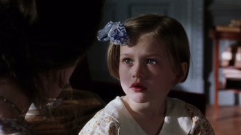 Movie still from “The Hours” (2002), directed by Stephen Daldry – A little girl with a blue bow in her hair; Close Up shot, Over the shoulder angle