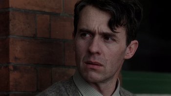 Movie still from “The Hours” (2002), directed by Stephen Daldry – A person looking at the camera; Close Up shot, Low angle