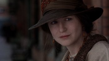 Movie still from “The Hours” (2002), directed by Stephen Daldry – A person wearing a hat; Close Up shot, Over the shoulder angle