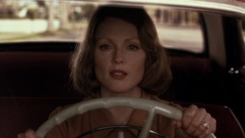 Movie still from “The Hours” (2002), directed by Stephen Daldry – A person driving a car; Close Up shot, Over the shoulder angle