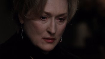 Movie still from “The Hours” (2002), directed by Stephen Daldry – A person wearing a black shirt; Close Up shot, Over the shoulder angle