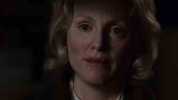 Movie still from “The Hours” (2002), directed by Stephen Daldry – An older woman with blonde hair and a white shirt; Close Up shot, Low angle