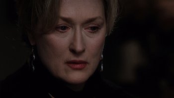 Movie still from “The Hours” (2002), directed by Stephen Daldry – A person wearing a black shirt; Close Up shot, Over the shoulder angle