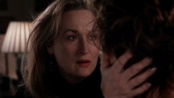 Movie still from “The Hours” (2002), directed by Stephen Daldry – A person with her hand on her face; Close Up shot, Over the shoulder angle