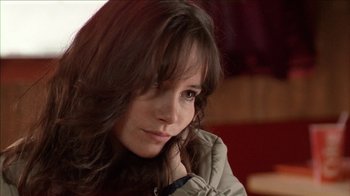 Movie still from “The House of the Devil” (2009), directed by Ti West – A person with long hair; Close Up shot, Over the shoulder angle