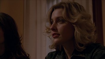 Movie still from “The House of the Devil” (2009), directed by Ti West – A person with long blonde hair; Close Up shot, Over the shoulder angle