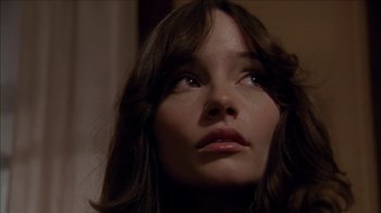 Movie still from “The House of the Devil” (2009), directed by Ti West – A woman's face looking upward; Close Up shot, Low angle