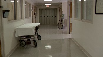 Movie still from “The House of the Devil” (2009), directed by Ti West – An empty hospital room with a bed in it; Wide shot, High angle