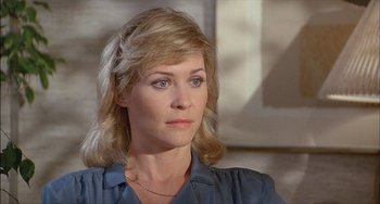 Movie still from “The Howling” (1981), directed by Joe Dante – A person wearing a blue shirt; Close Up shot, High angle