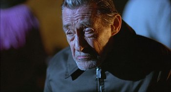 Movie still from “The Howling” (1981), directed by Joe Dante – An older man with a beard and a mustache; Close Up shot, Over the shoulder angle