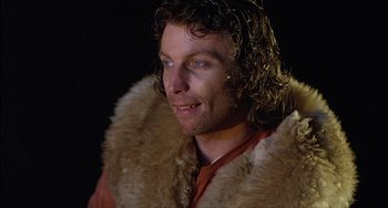 Movie still from “The Howling” (1981), directed by Joe Dante – A person wearing a fur coat; Close Up shot, Low angle