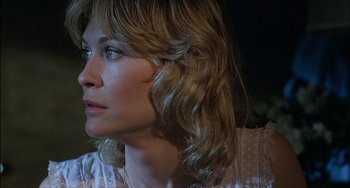 Movie still from “The Howling” (1981), directed by Joe Dante – A person with long blonde hair; Close Up shot, Over the shoulder angle