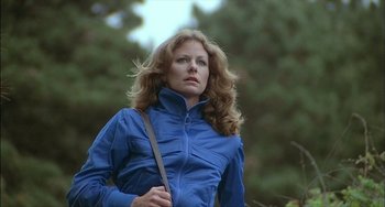 Movie still from “The Howling” (1981), directed by Joe Dante – A woman in a blue jacket is holding a bag; Close Up shot, Low angle