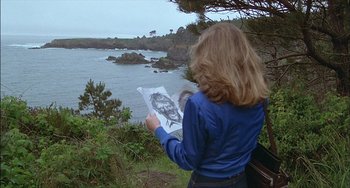 Movie still from “The Howling” (1981), directed by Joe Dante – A woman standing on a hill looking at a drawing; Wide shot, Over the shoulder angle