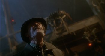 Movie still from “The Howling” (1981), directed by Joe Dante – An old man wearing a hat looking up at the sky; Close Up shot, Low angle