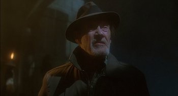 Movie still from “The Howling” (1981), directed by Joe Dante – An old man wearing a hat and a jacket; Close Up shot, Low angle