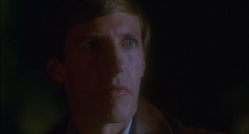 Movie still from “The Howling” (1981), directed by Joe Dante – A person looking at the camera; Close Up shot, Low angle