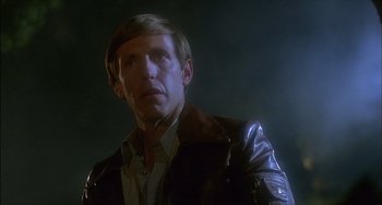 Movie still from “The Howling” (1981), directed by Joe Dante – A man in a leather jacket looking at the camera; Close Up shot, Low angle