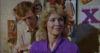 Movie still from “The Howling” (1981), directed by Joe Dante – A woman in a purple shirt and a man in a brown tie; Close Up shot, Over the shoulder angle