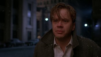 Movie still from “The Hudsucker Proxy” (1994), directed by Ethan Coen – A person wearing a jacket; Close Up shot, Over the shoulder angle