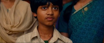 Movie still from “The Hundred-Foot Journey” (2014), directed by Lasse Hallström – A young boy is looking into the distance; Close Up shot, High angle