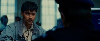 Movie still from “The Hundred-Foot Journey” (2014), directed by Lasse Hallström – A man looking at himself in the mirror in front of another man; Close Up shot, Over the shoulder angle