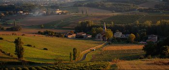 Movie still from “The Hundred-Foot Journey” (2014), directed by Lasse Hallström – An aerial view of a rural area with a church; Extreme Wide shot, High angle