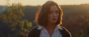 Movie still from “The Hundred-Foot Journey” (2014), directed by Lasse Hallström – A person wearing a white shirt; Close Up shot, Over the shoulder angle