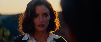 Movie still from “The Hundred-Foot Journey” (2014), directed by Lasse Hallström – A person with short brown hair; Close Up shot, Over the shoulder angle