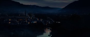 Movie still from “The Hundred-Foot Journey” (2014), directed by Lasse Hallström – A view of a town at night with smoke coming from the chimney; Extreme Wide shot, High angle